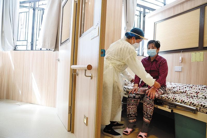 China Daily HK article: A senior is attended to at the care home. (EDMOND TANG / CHINA DAILY)